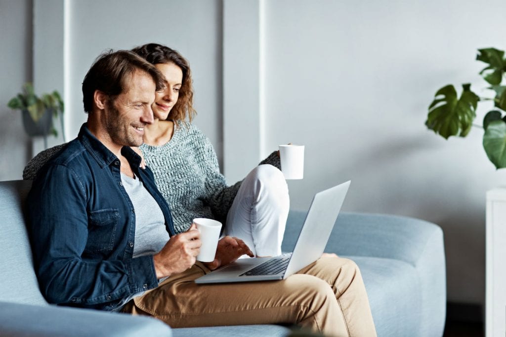 Property investors drinking coffee and looking at market updates